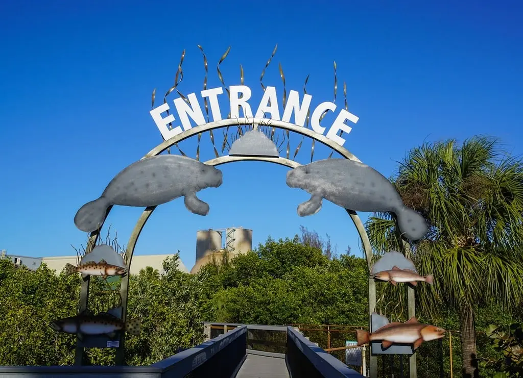 A sign that says entrance with two dolphins on it. Manatee viewing area  apollo beach. - PICRYL - Public Domain Media Search Engine Public Domain  Image