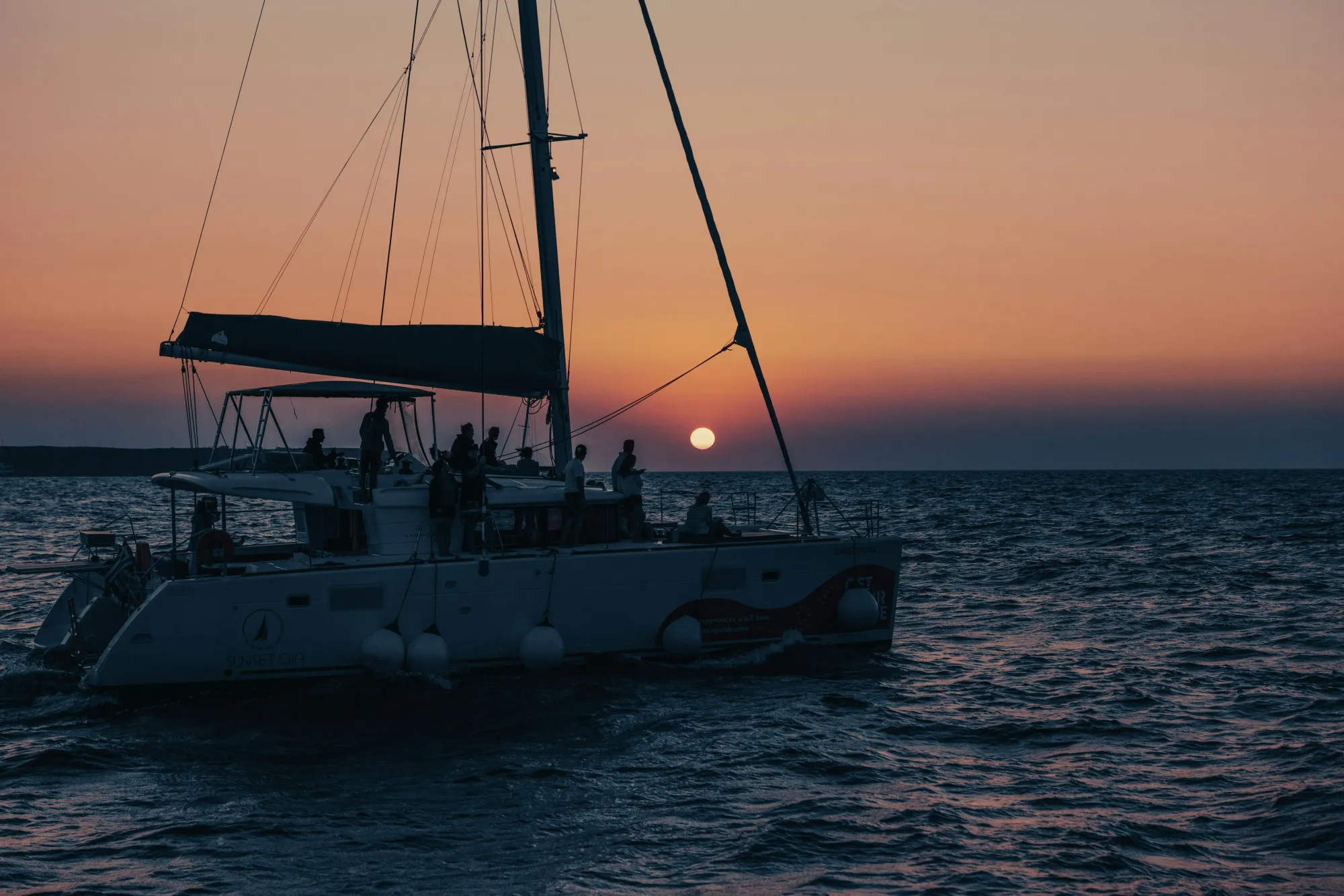 People Riding on Sailboat during Sunset · Free Stock Photo