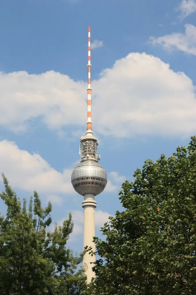 A tall tower with a red and white top Berlim berlin tv tower. - PICRYL -  Public Domain Media Search Engine Public Domain Image